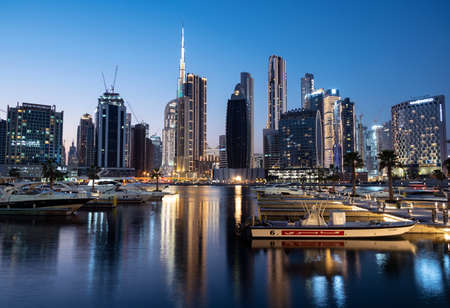 March 5th,2021, Dubai,UAE. View of the illuminated cruise ships lined up along with Burj khalifa and other sky scrappers captured from the Marasi drive at the Business bay district, Dubai, UAE.のeditorial素材