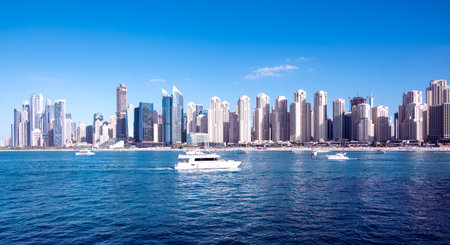 Dec 17 2020, Al seef village, Dubai. Panoramic view of the illuminated sky scrappers,hotels and buildings showing beautiful reflections in water captured at the Al Seef, Dubai ,UAE.のeditorial素材