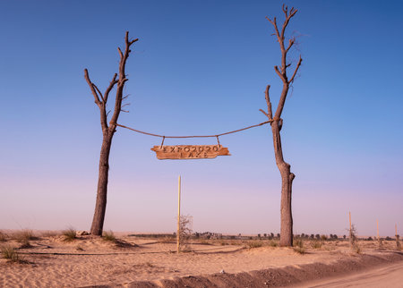 Dec 27th,2020, Dubai,UAE. The beautiful entrance banner to the expo 2020 lakes with muddy desert path in the Qudra region at the Expo 2020 lake, Dubai, UAE.のeditorial素材