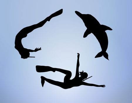 silhouette of two females snorkeling with a dolphin under waterの写真素材