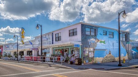 Tarpon Springs, Florida. An underwater wall mural is painted on the building in downtown. Shops and Hella's famous bakery is shown.のeditorial素材