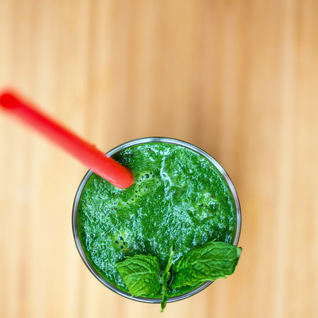 Green healthy smoothie with spinach, green apple and celeryの写真素材