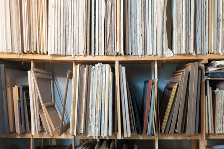 A shelf rack with paintings in artist studioの写真素材