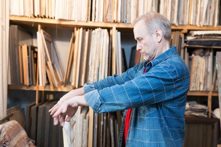 An artist crafting canvas. Selective focus