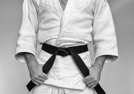 Martial arts Master with black belt in white kimono. Black and whiteの写真素材