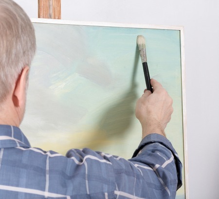 An artist painting in studio. Selective focusの写真素材