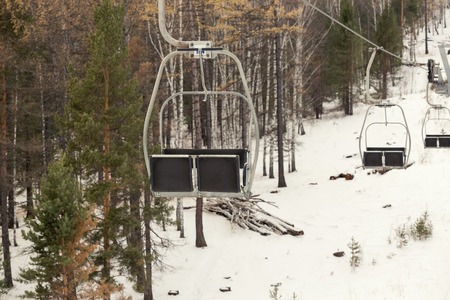 A ski lift on winter forest landscapeの写真素材
