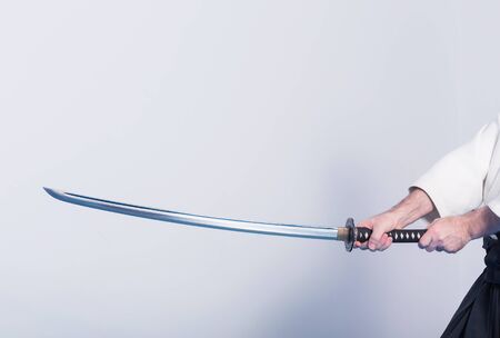 Hands holding the Katanaの写真素材