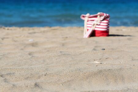 Beach tote on a sandy beach out of focusの写真素材