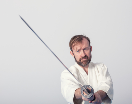 A man with katana on Iaido practiceの写真素材