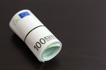 Roll of one hundred euro billsの写真素材