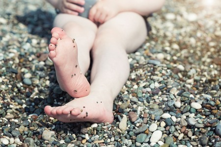 Little feet on the beachの写真素材