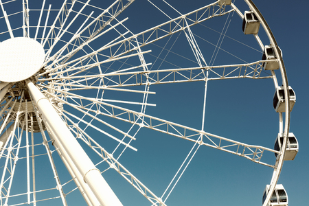 Ferris wheel over a blue skyの写真素材
