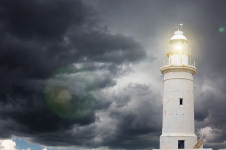 Lighthouse against stormy skyの写真素材