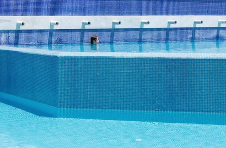 Little girl swimming in a poolの写真素材