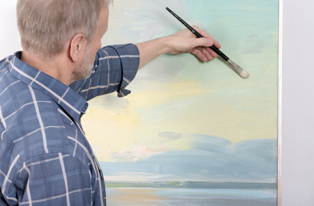 An artist painting in studioの写真素材