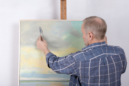 An artist painting in studio. Selective focusの写真素材