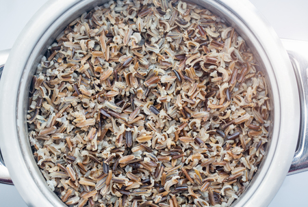 A pot with steamed black rice close-upの写真素材