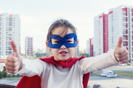 Superhero kid against urban backgroundの写真素材