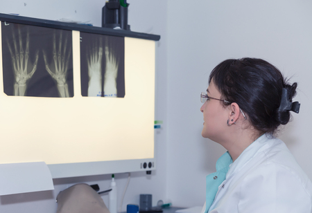 Female doctor looking at the x-ray testの写真素材