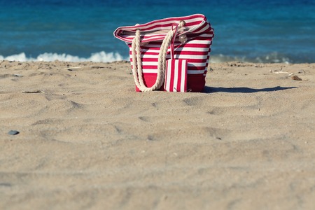 Beach tote on a sandy beachの写真素材