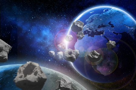 Asteroids flying close to the planet Earth.の写真素材