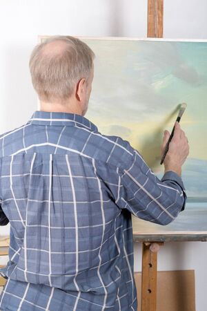 An artist painting in studioの写真素材