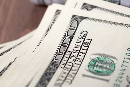 A pile of one hundred US dollar billsの写真素材