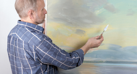 An artist painting in studioの写真素材