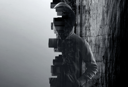 Suspicious man in hoodyの写真素材