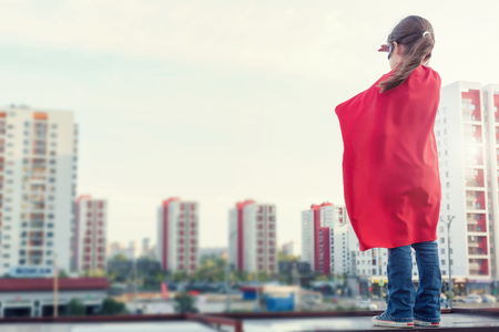 Superhero kid against urban backgroundの写真素材
