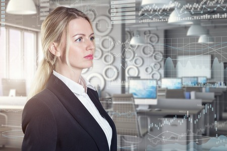 A businesswoman using diagrams on virtual displayの写真素材