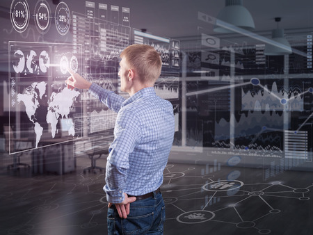 A businessman using diagrams on virtual displayの写真素材