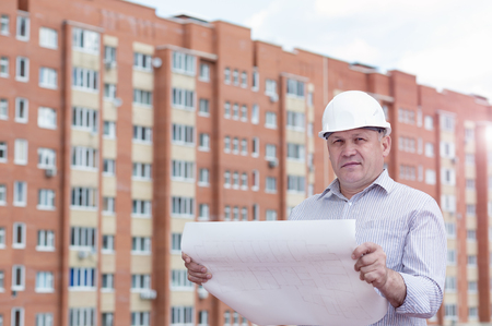 An engineer with construction plansの写真素材