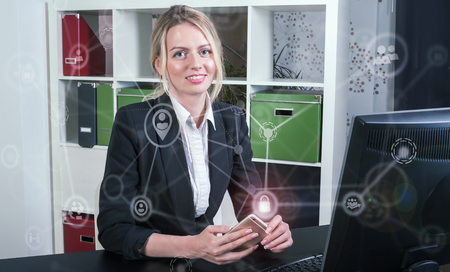 Keep your data safe concept with a lady holding phoneの写真素材