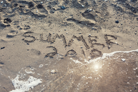 The Word Summer 2018 Written in the Sand on a Beachの写真素材