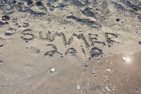The Word Summer 2018 Written in the Sand on a Beachの写真素材