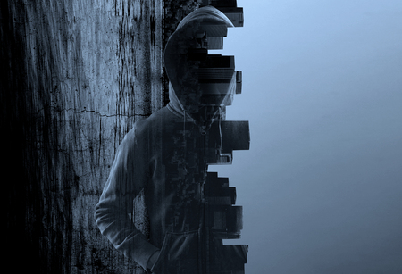 Suspicious man in hoodyの写真素材