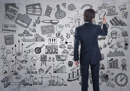 A businessman drawing a business sketchの写真素材
