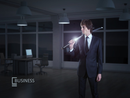 Businessman and japanese swordの写真素材