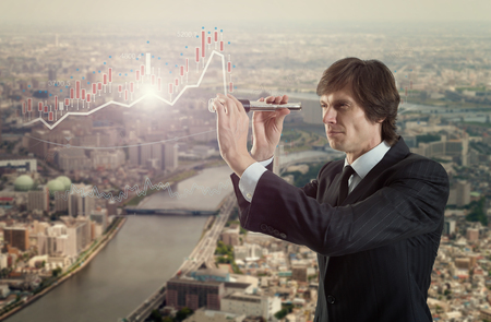 A businessman looking with spyglass for best dealの写真素材