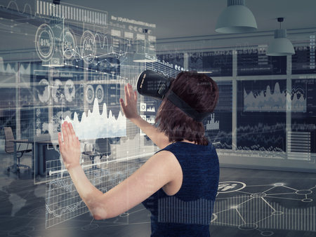 Young woman using a virtual reality headsetの写真素材