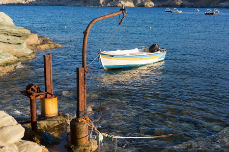 Small motor boats floating on waterの写真素材
