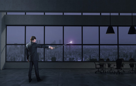 Businessman and japanese sword in the office