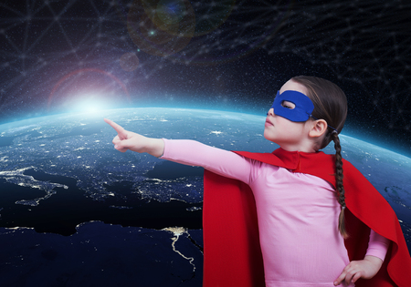 Superhero kid against the Earth.の写真素材