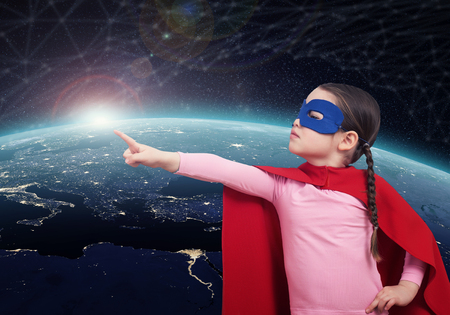 Superhero kid against the Earth. 3D renderingの写真素材