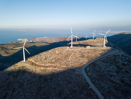 Aerial photo of windmills and blue sea at sunsetの写真素材