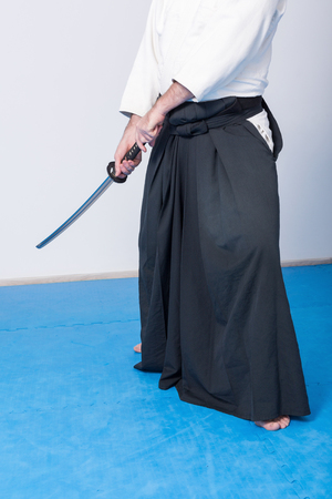 A man with katana on Iaido practiceの写真素材