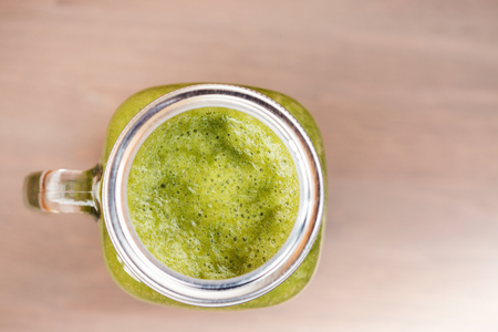 A green smoothie in a mason jarの写真素材