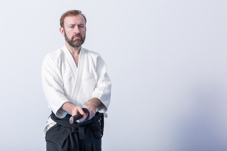 A man with katana on Iaido practiceの写真素材